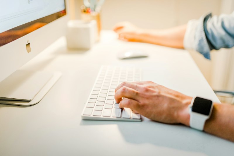 Web designer reviewing conversion funnel analytics and heatmap for landing page