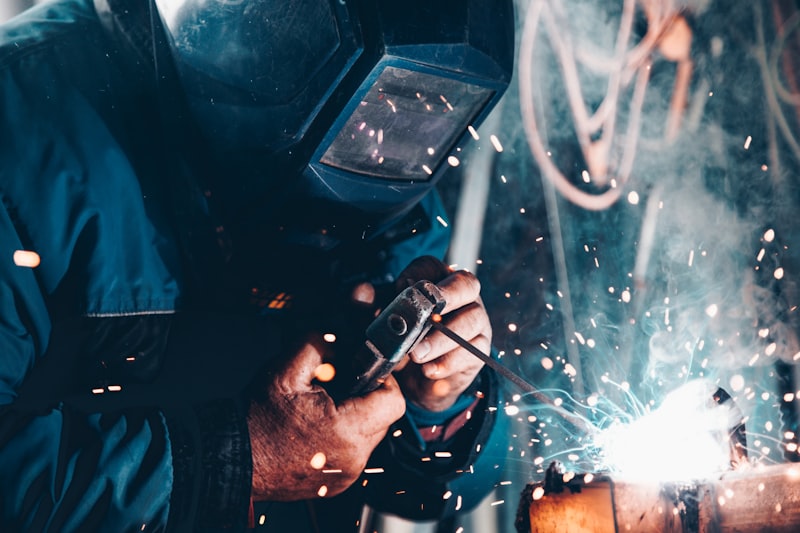 Manufacturing professional reviewing company digital presence and website analytics