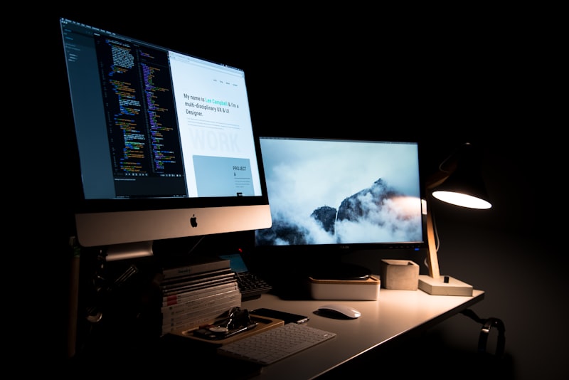 Web designer reviewing a modern business website on professional workstation