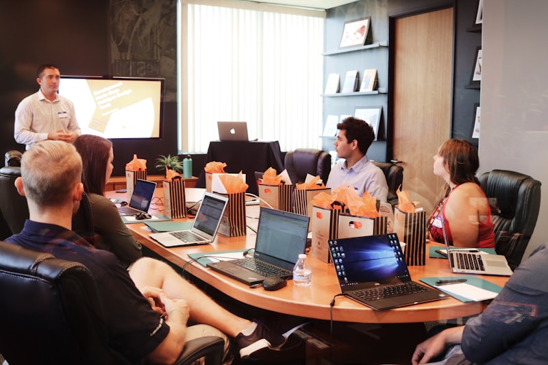 Sales professional reviewing CRM pipeline and customer records on screen
